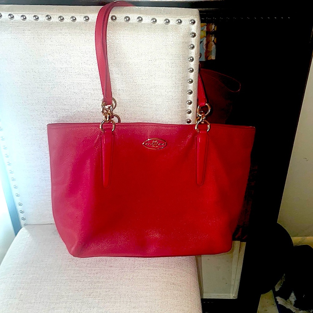 Coach like new handbag. Beautiful warm pinkish/red color.